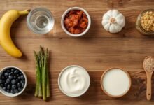 Probiotic And Prebiotic Food Pairings: Complete Meal Plan (2026) 18 Alt text: a luxury flat lay of probiotic and prebiotic food pairings including kefir, asparagus, and kimchi on a wooden surface, 4k clinical aesthetic.